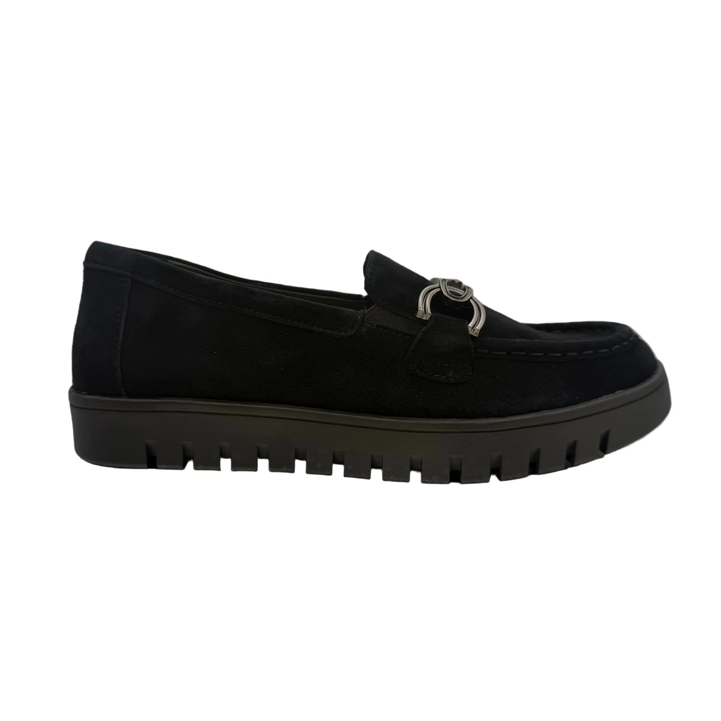 A black slip-on loafer-style shoe with a textured sole and a metallic ring detail on the vamp.