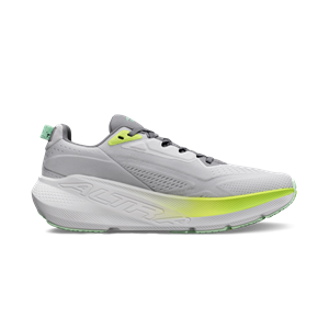 White running shoe with green accents on a white background