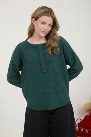 Hunter green long sleeve shirt with buttons on an exposed edge placket with long sleeve shirt.