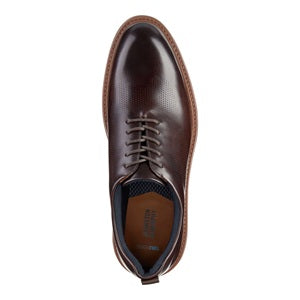 Brown leather dress shoe on a white background
