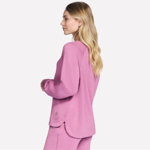 Woman wearing a pink suit on a white background