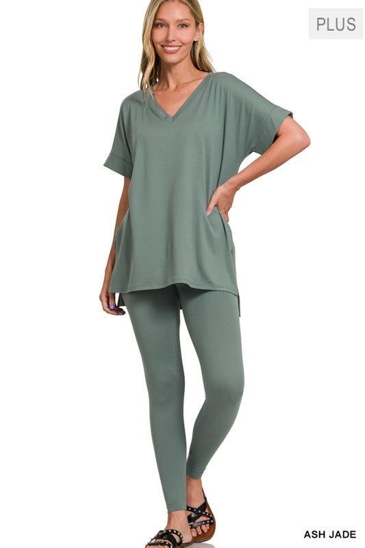 Woman wearing a green outfit with a plain background