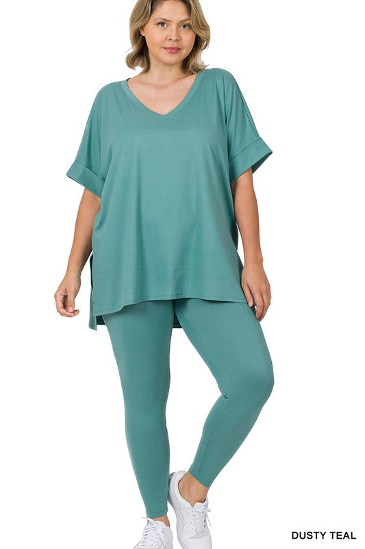 Woman wearing a teal outfit on a white background