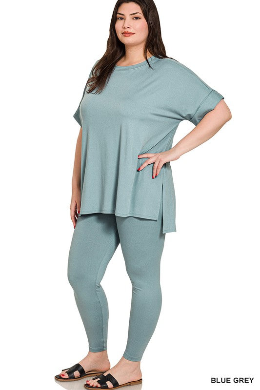 Woman wearing a blue-grey outfit on a white background