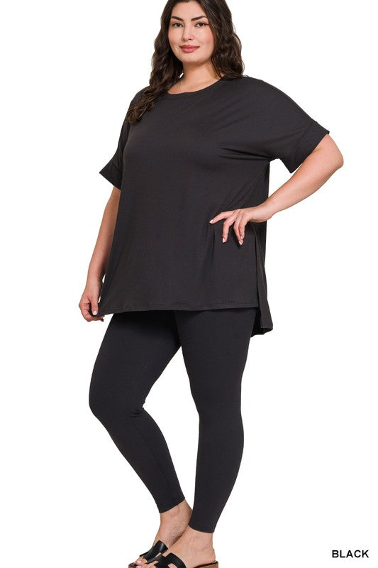 Woman wearing a black outfit on a white background