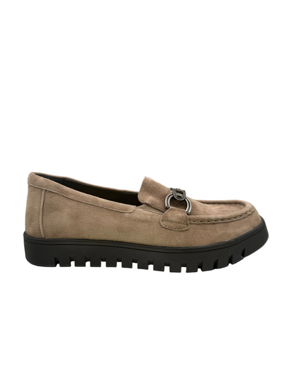 Taupe suede slip-on loafer with a black lug sole and a metallic ring detail on the vamp.