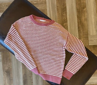 Knitted sweater with a pattern on a dark surface