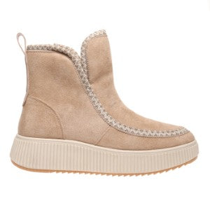 Beige ankle boot with white sole on a white background