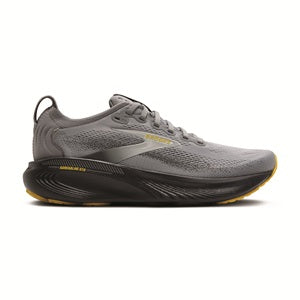 Gray running shoe with yellow sole on a white background