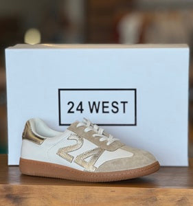 Beige sneaker with brown sole on a white box featuring '24 WEST' branding.