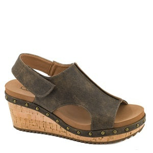 Brown wedge sandal with cork sole on a white background