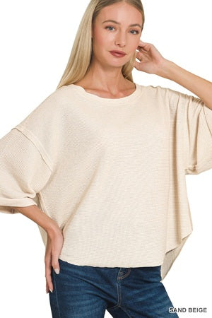 sand beige sweater paired with blue jeans
