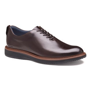 Brown leather dress shoe on a white background