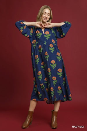 Woman wearing a blue floral dress on a red background