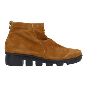 Brown suede ankle boot with black sole on a white background
