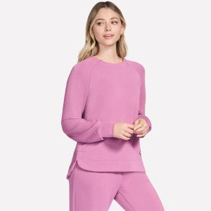 Woman wearing a pink outfit on a white background