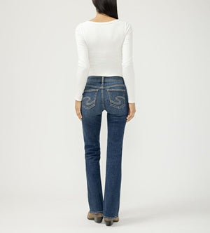Person wearing blue jeans and a white top on a white background
