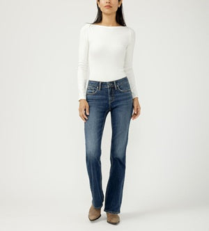 Person wearing a white long-sleeve shirt and blue jeans on a white background