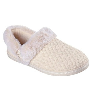 Beige slipper with fur trim on a white background