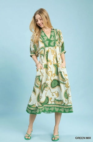 women's green and gold paisley print midi dress with a V-neckline and elbow-length sleeves