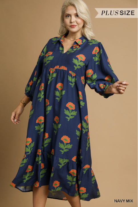 Woman wearing a navy dress with floral pattern on a beige background