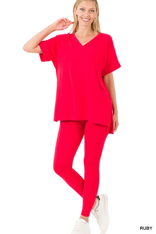 Woman wearing a bright red outfit on a white background