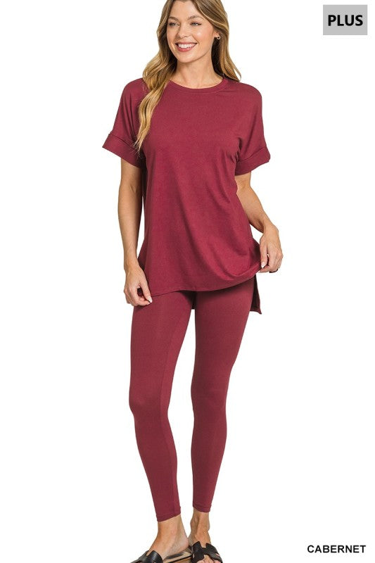 Woman wearing a cabernet red outfit on a white background