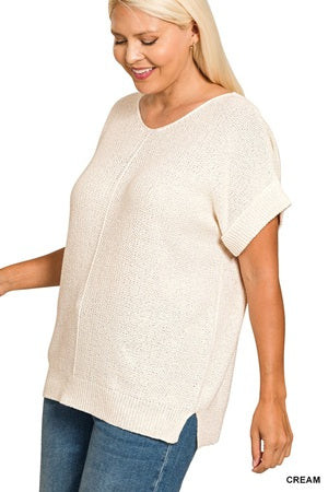 Plus size women's cream-colored knit top with short sleeves