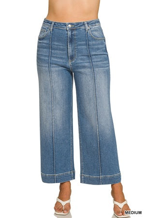 medium-wash blue cropped wide-leg denim jeans with front pleats and contrast stitching