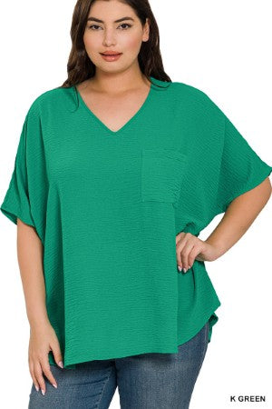 women's plus size green oversized dolman sleeve shirt with a pocket