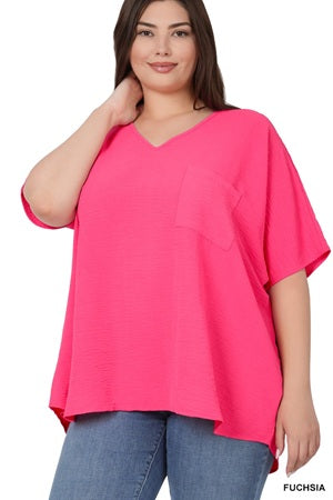 Women's plus size bright pink top with a V-neck and short sleeves