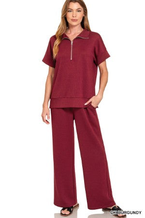 women's burgundy quarter zip pant set with a white background